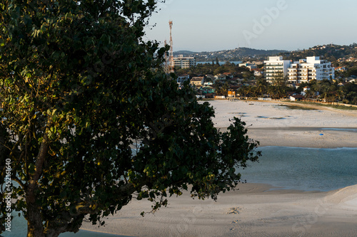 Sunset at Itaúna Beach, Saquarema in Rio de Janeiro, Brazil. Famous for waves and surfing. photo