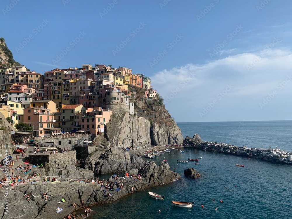 Skyline of Manarola village. It is a one of the village Cinque terre towns included to the UNESCO world heritage sites. Colourful houses on cliff. Manarola, Cinque Terre, Liguria, Italy.