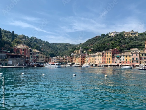 Skyline of Portofino village with colourful houses and emerald water. It is famous holiday resort and fishing Italian riviera town. Portofino, Italy