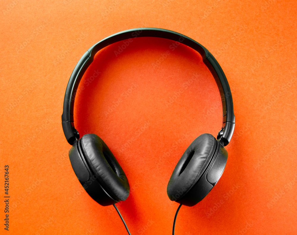 Headphones on a orange background Headphones on a orange background