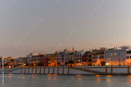 City lights reflecting in the river at night | Seville, Spain