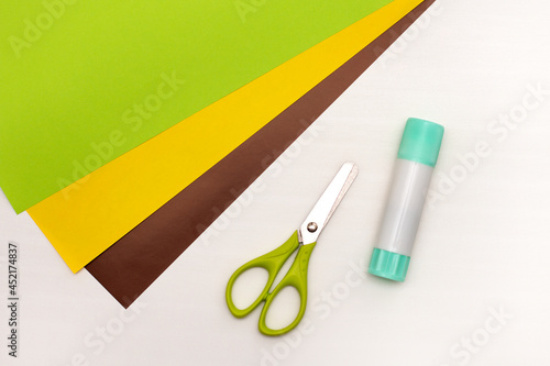 Step-by-step instructions for making Christmas Tree Corner Bookmarks. DIY. Creative origami ideas for kids. Top view flat lay. Step 1 - preparing all necessary equipment. 