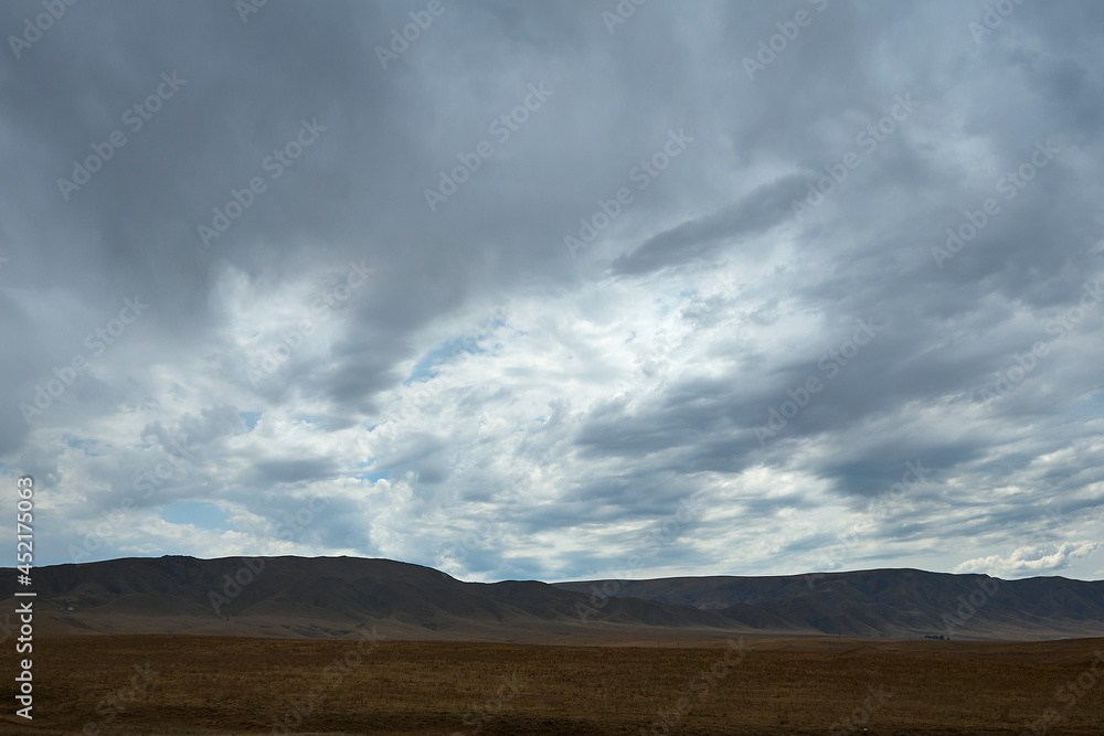 Nature of the Kazakhstan Republic, steppes and hills, mountains and sky Nature of the Kazakhstan Republic, steppes and hills, mountains and sky