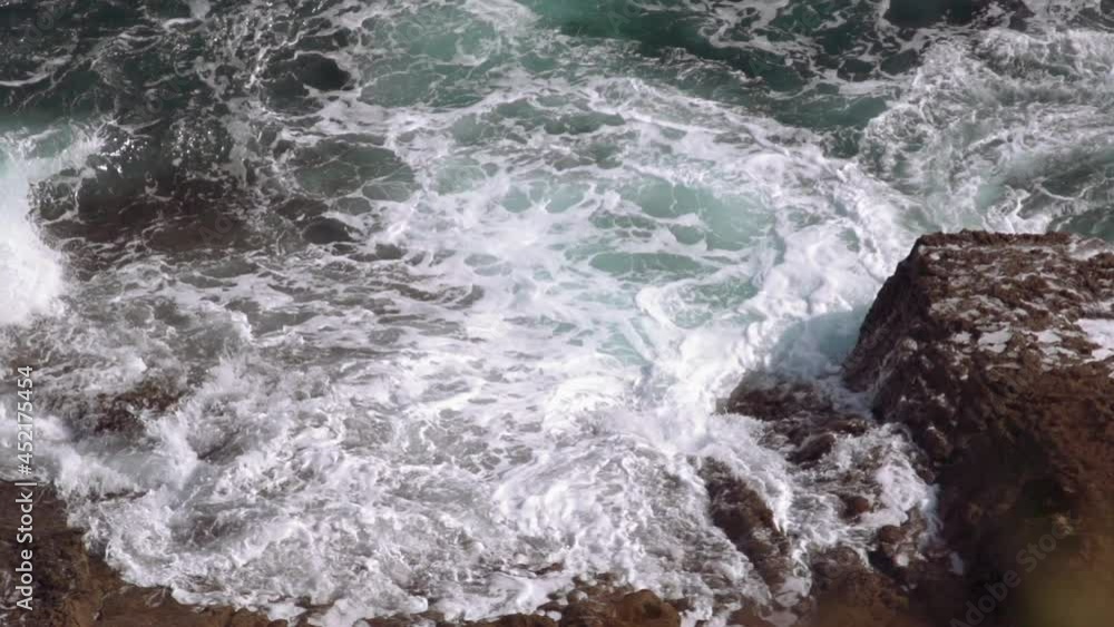 The waves of the Atlantic Ocean beat against the rocks The waves of the Atlantic Ocean beat against the rocks