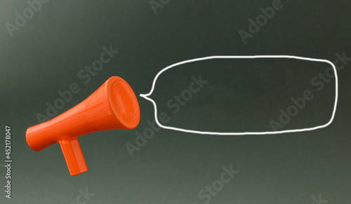 Red 3d megaphone with empty speech balloon against black background. Advertisement idea. Minimal banner ad concept. Abstract 3D Background Art