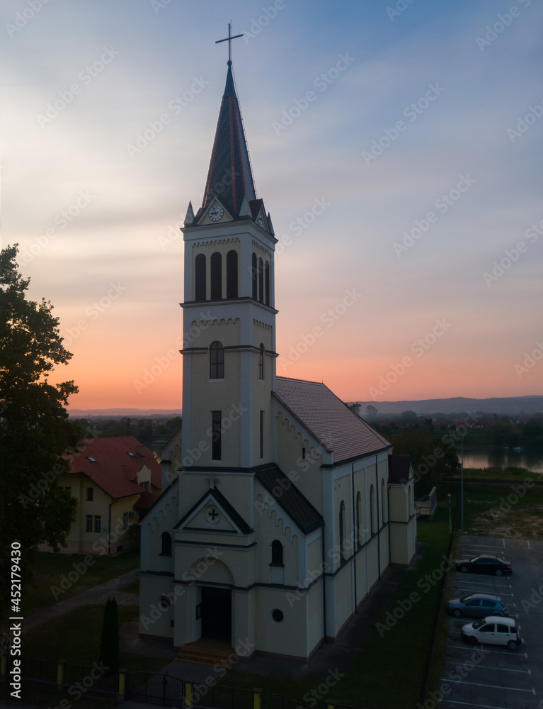 Fototapeta premium Catholic church dedicated to Saint Elijah the Prophet in Bosanski Brod during beautiful sunset