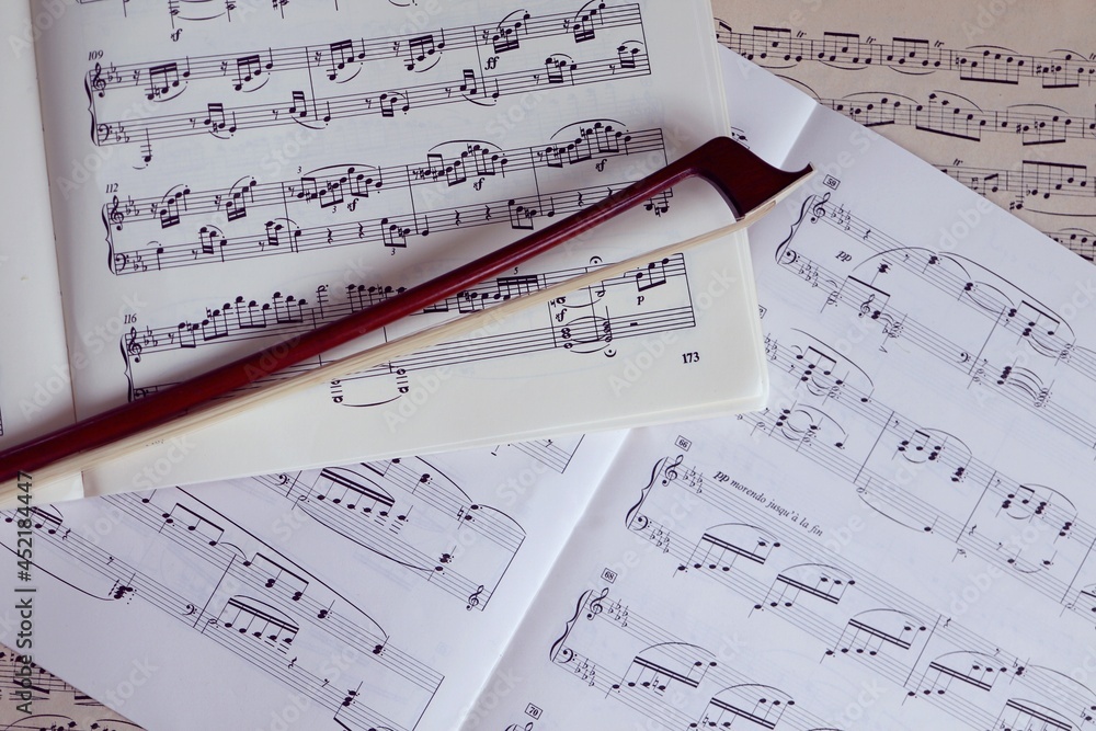 Fototapeta premium close up of a bow on musical piano scores 