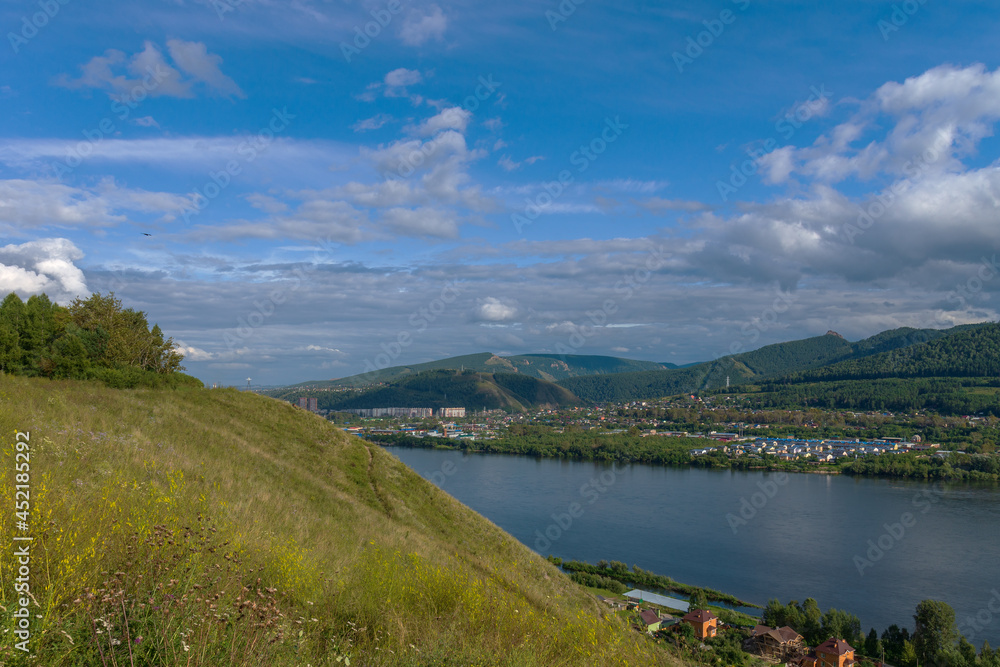 View of the city and the Pillars of Krasnoyarsk from the high bank of the Yenisei
