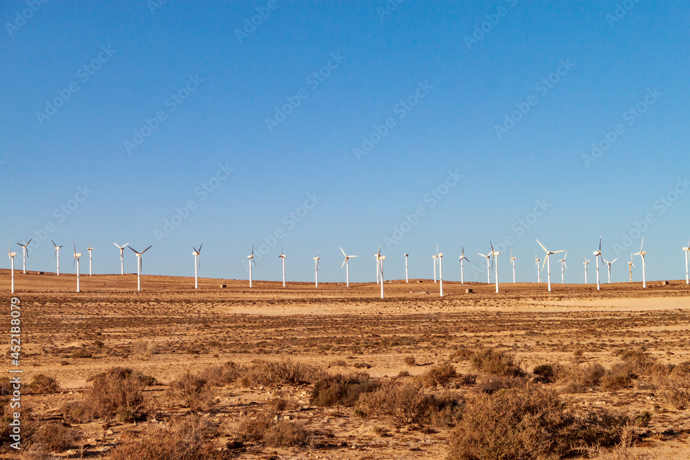 Electric wind turbines in the rocky desert