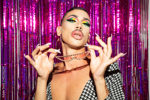 Fotografie Diva no binary posing in glitter night