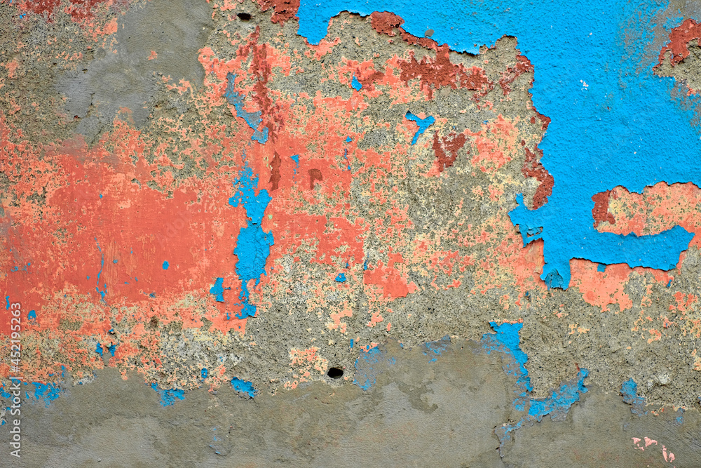 Beautiful old wall covered in many coats of old paint, patches of pink, orange and blue color create vivid and contrasty aesthetic patchwork. Beautiful old wall covered in many coats of old paint, patches of pink, orange and blue color create vivid and contrasty aesthetic patchwork.