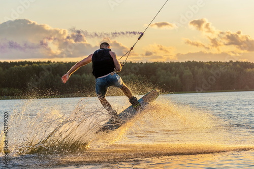 Fényképezés shot of man wakeboarding on a lake