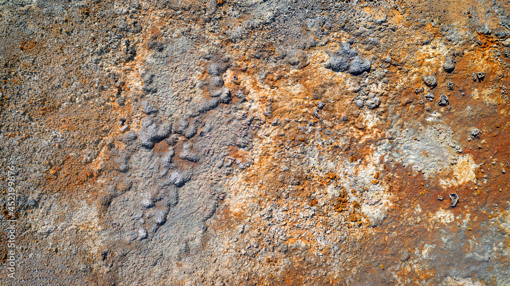 Rough wall texture in abandoned mine with spots of rust and peeling plaster Rough wall texture in abandoned mine with spots of rust and peeling plaster