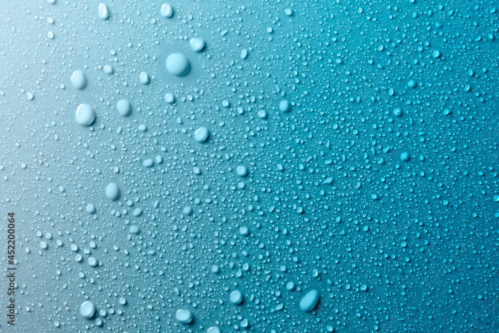 Water drops on smooth surface, blue background - obrazy, fototapety, plakaty 