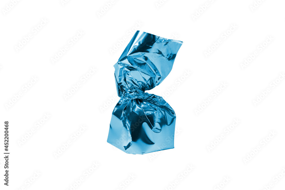 Chocolate candy in a blue wrapper isolated white background. Chocolate candy in a blue wrapper isolated white background.