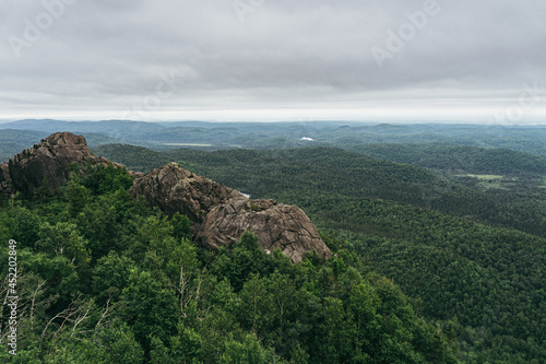 View on the Valin river, the forest on a cloudy day from the top of Pic de la Tete de Chien, a peak of Monts Valin National Park in Saguenay (Quebec, Canada)