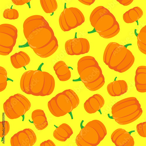 Seamless pattern with hand drawn pumpkins on yellow background. Vector eps illustration