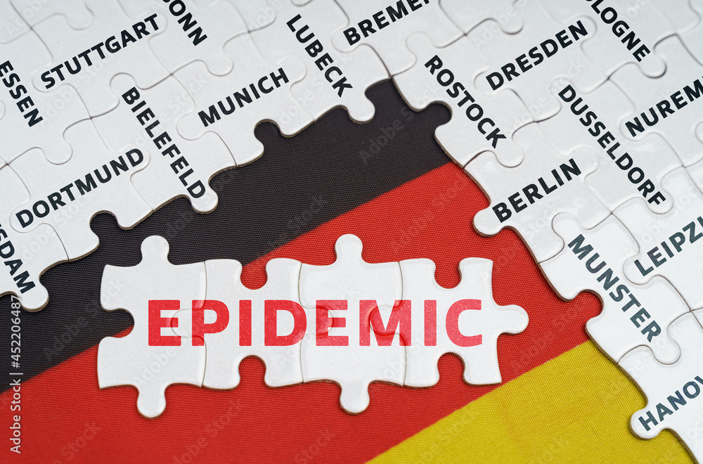 On the flag of Germany there are puzzles with the names of cities and puzzles with the inscription - EPIDEMIC