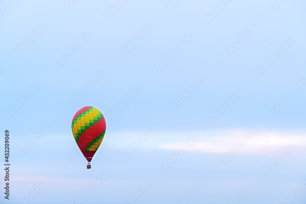 Hot air balloon with light blue evening sky Hot air balloon with light blue evening sky