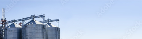 View of the modern outdoor grain storage silos. Background agriculture. Space for your text