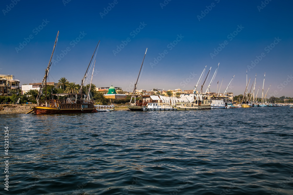 Luxor, Egypt - Jan 28, 2020:The touristic boats on Nile river in Luxor, Egypt
