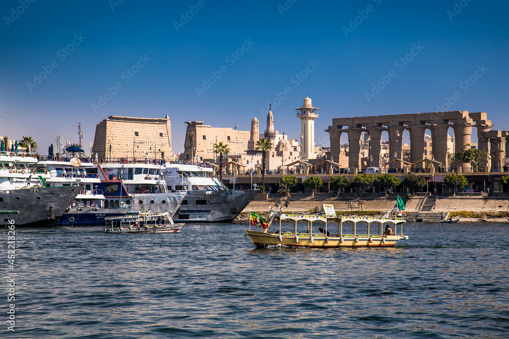 Luxor, Egypt - Jan 28, 2020:The touristic boats on Nile river in Luxor, Egypt
