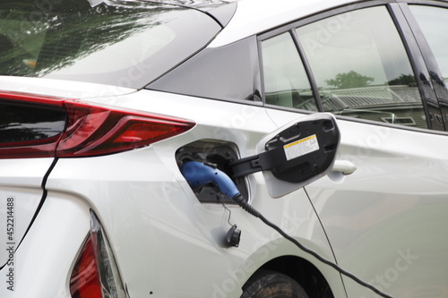 The electric car is getting the battery charged, all cars will be that way in the future.