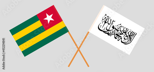 Crossed flags of Togo and Islamic Emirate of Afghanistan. Official colors. Correct proportion