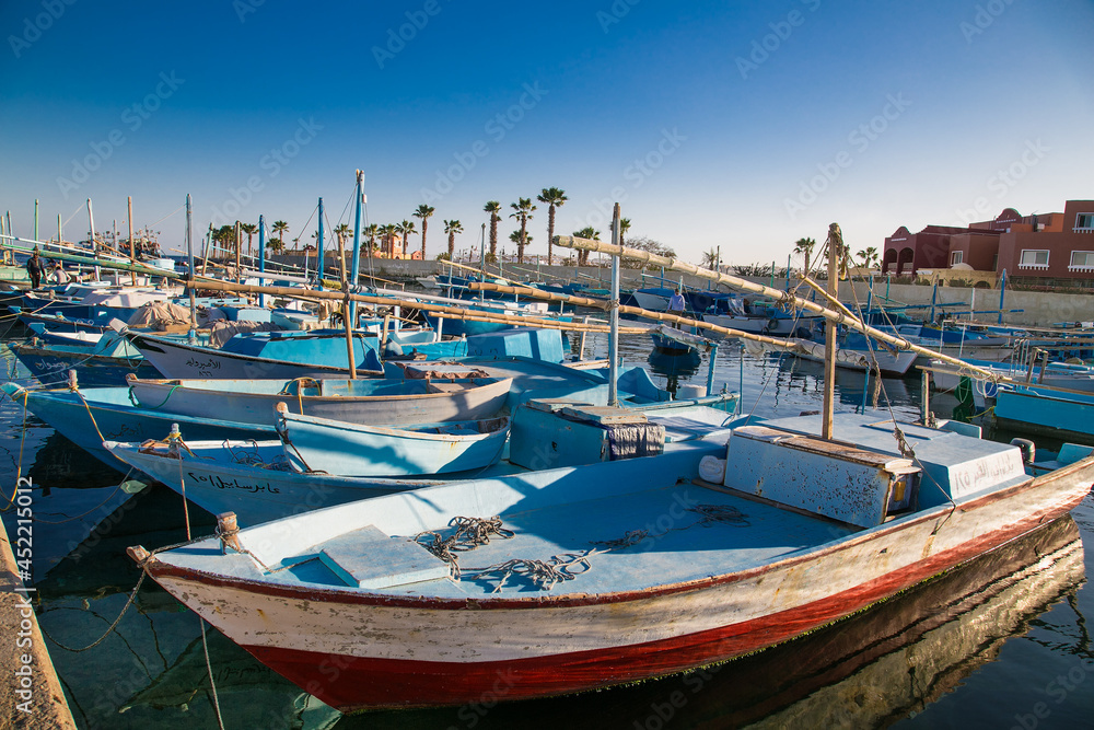 Old fishing boats in the sea harbor of Hurghada, Egypt