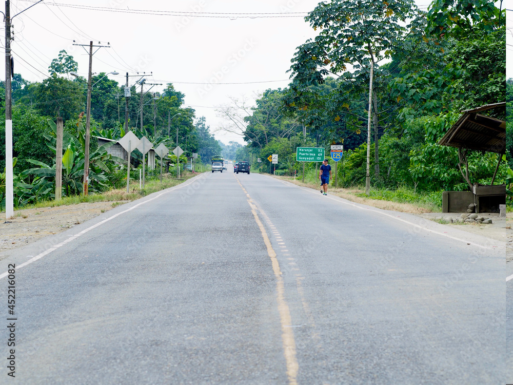 South of Ecuador - 20.06.2015: Two walkers on the hard shoulder of a road