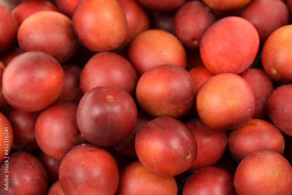 Red mirabelle fruits closeup, mirabelle fruits background.