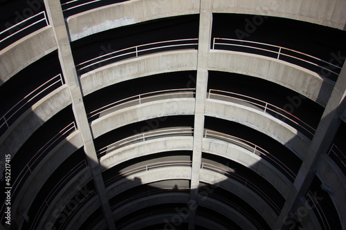 A high angle shot of a circular concrete parking garage structure
