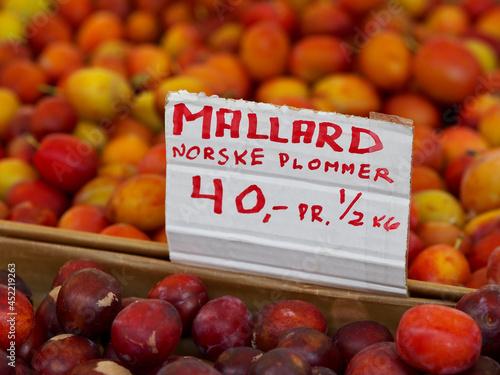 Photography Baskets of plums in a street market in Oslo, Norway