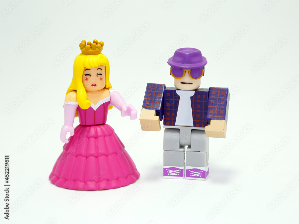 Plastic toy figures with characters from the Roblox video game. Roblox  dolls. Blonde princess with pink dress and crown. Man with sunglasses.  Isolated white. Stock Photo | Adobe Stock