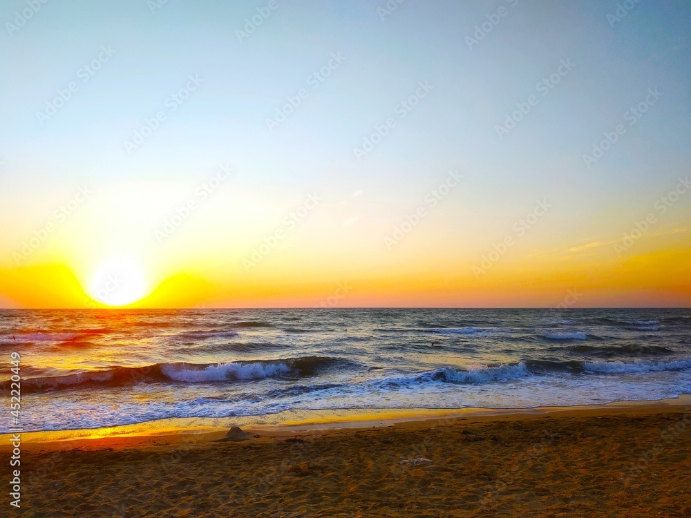 Colorful sunset on seashore.