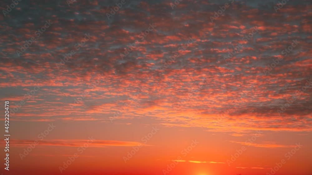 4K Sunset Cloudy Sky With Fluffy Clouds. Sunset Sky Natural Background. Dramatic Sky. Sunset Time Lapse Time-Lapse In Yellow, Orange, Pink Colors. Day To Night Transition 4K Sunset Cloudy Sky With Fluffy Clouds. Sunset Sky Natural Background. Dramatic Sky. Sunset Time Lapse Time-Lapse In Yellow, Orange, Pink Colors. Day To Night Transition
