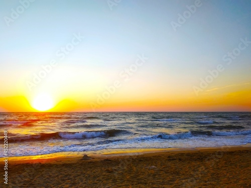 Fototapeta Naklejka Na Ścianę i Meble -  Colorful sunset on seashore.