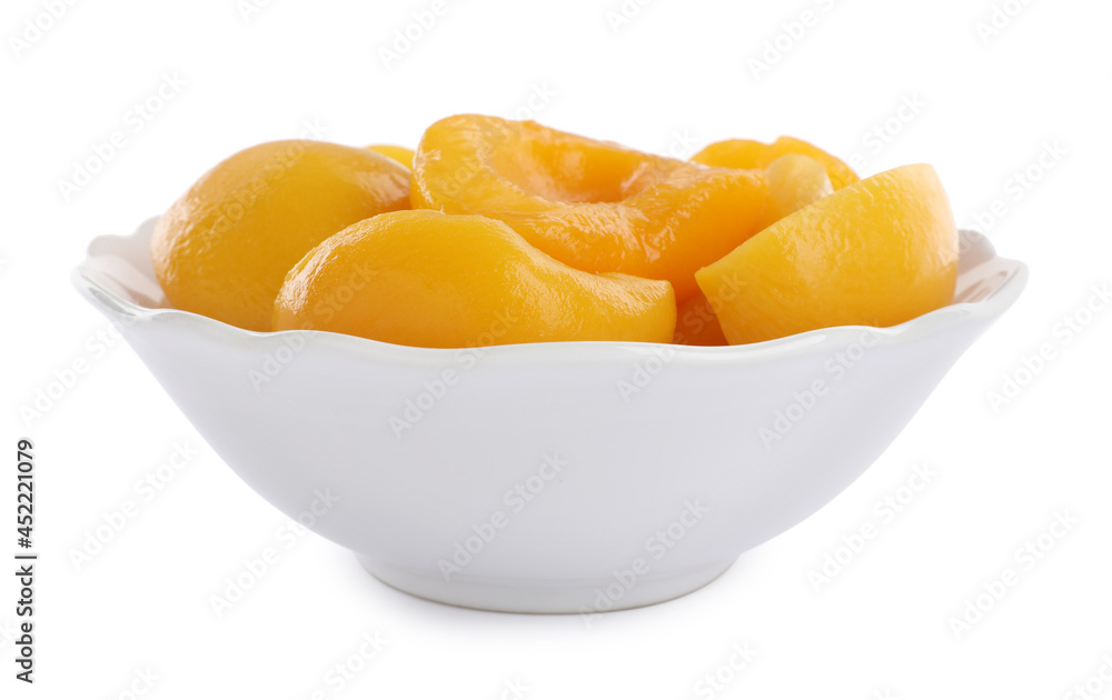 Halves of canned peaches in bowl isolated on white Halves of canned peaches in bowl isolated on white
