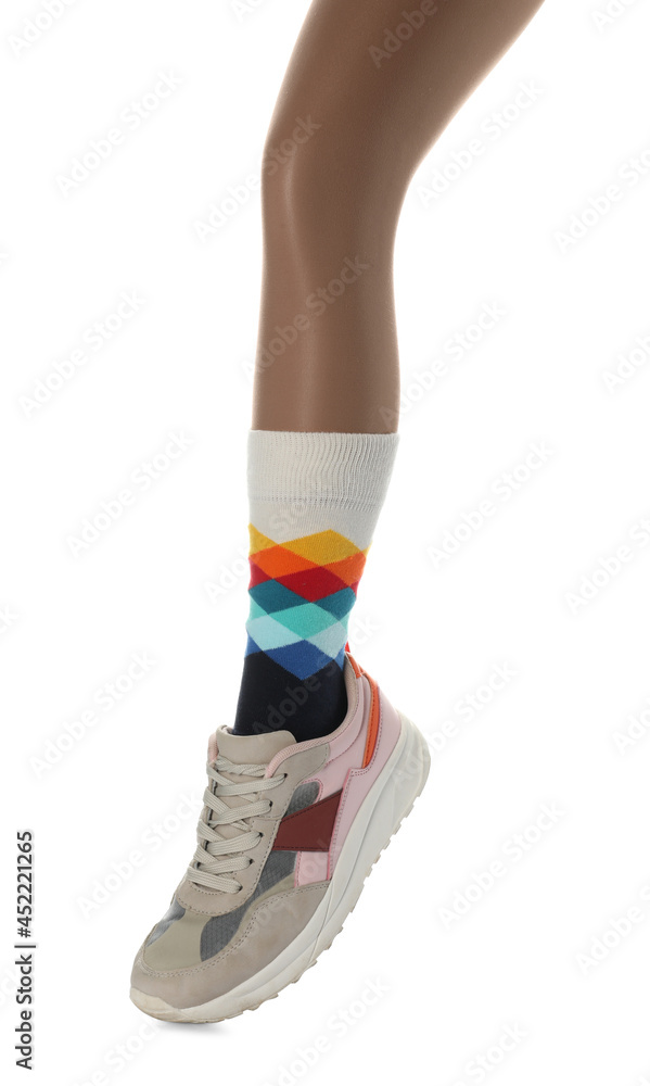 Woman wearing sneakers on white background, closeup Woman wearing sneakers on white background, closeup