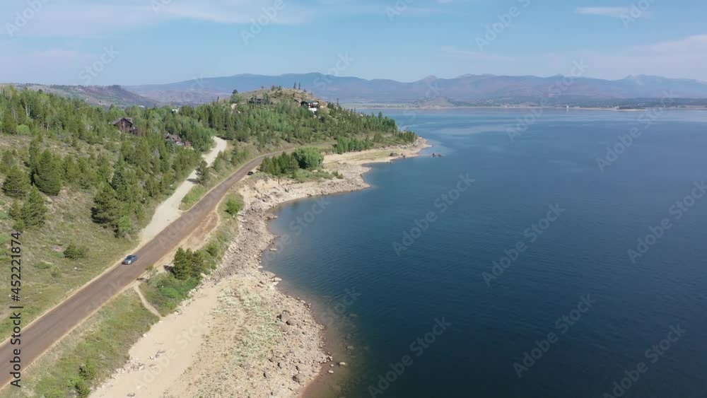 Aerial view of Lake Granby, Colorado and surrounding mountains and forests on clear calm summer morning 4K. Aerial view of Lake Granby, Colorado and surrounding mountains and forests on clear calm summer morning 4K.