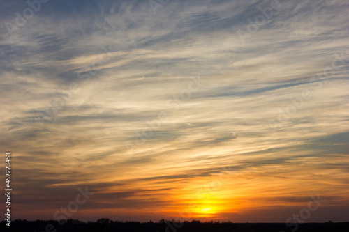 A wide shot of a dramatic sunset or sunrise sky © Jaden