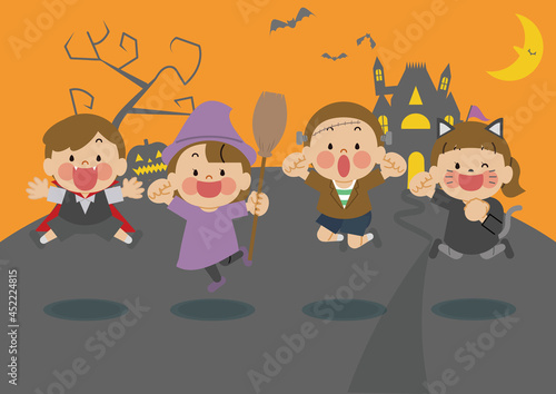 魔女の城でハロウィンの仮装をしてジャンプする子供たち