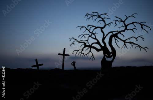 Silhouette some zombies on the cemetery walking around at sunset. Selective focus