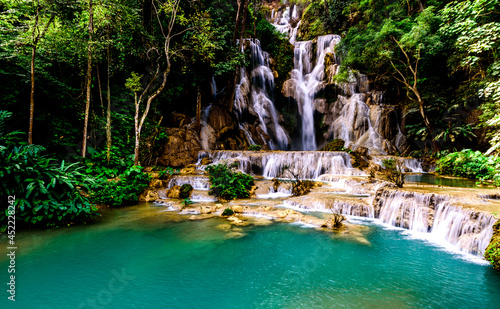 The Kuang Si Falls or Kuang Xi Falls (Lao: ນ້ຳຕົກຕາດ ກວາງຊີ), alternatively known as the Tat Kuang Si Waterfalls, is a three-tiered waterfall about 29 kilometers (18 mi) south of Luang Prabang. The wa