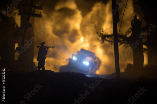 Military soldier silhouette with bazooka. War Concept. Military silhouettes fighting scene on war fog sky background, Soldier Silhouette aiming to the target at night.