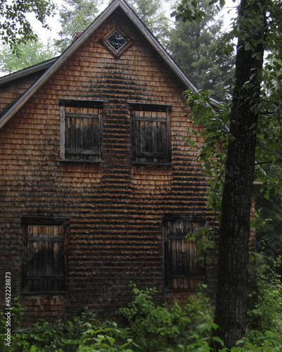 old wooden house in forest © SofotoCool