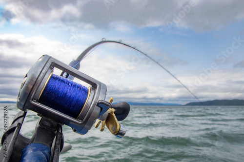 Rod and Reel on a boat Trolling (a form of fishing) for salmon in South East Alaska.