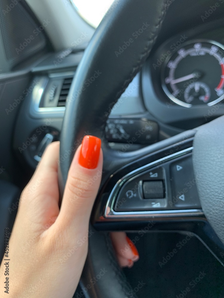 manicure on the background of the car manicure on the background of the car