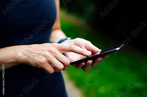 Close up of female hands using a smart phone