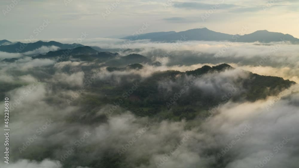 Hyper lapse by Drone, Beautiful Landscape in the morning time during sunrise with fog above the mountain, White fluffy clouds moving softly on cloudy, Pang puai Mae moh Lampang, Thailand. Hyper lapse by Drone, Beautiful Landscape in the morning time during sunrise with fog above the mountain, White fluffy clouds moving softly on cloudy, Pang puai Mae moh Lampang, Thailand.